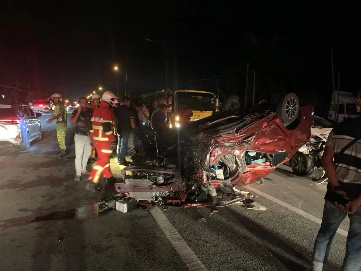 M'sian firefighters inspecting car crash which killed Norsyam Nasullah Rahim