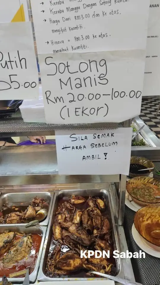 Sign at Sabah stall showing the price range of squid