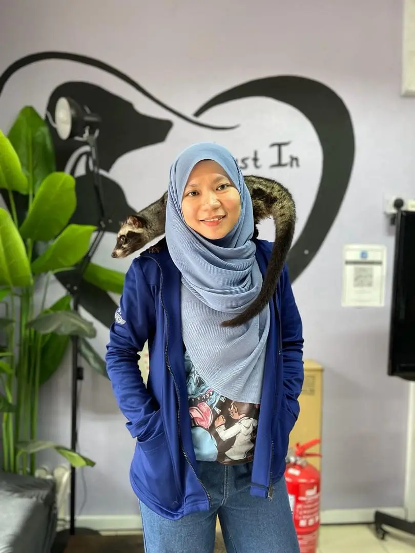 Dr Salehatul Khuzaimah with a ferret