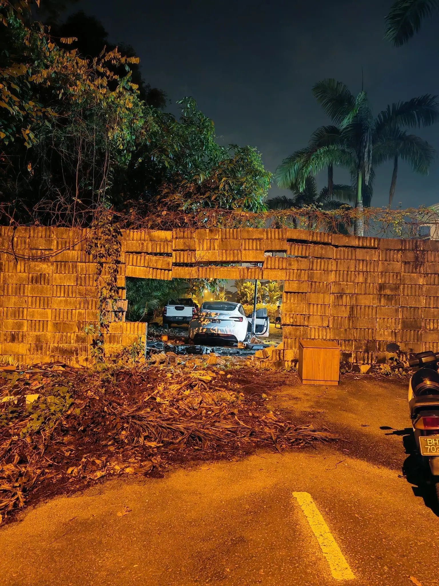Tesla rams through brick wall in Seri Kembangan
