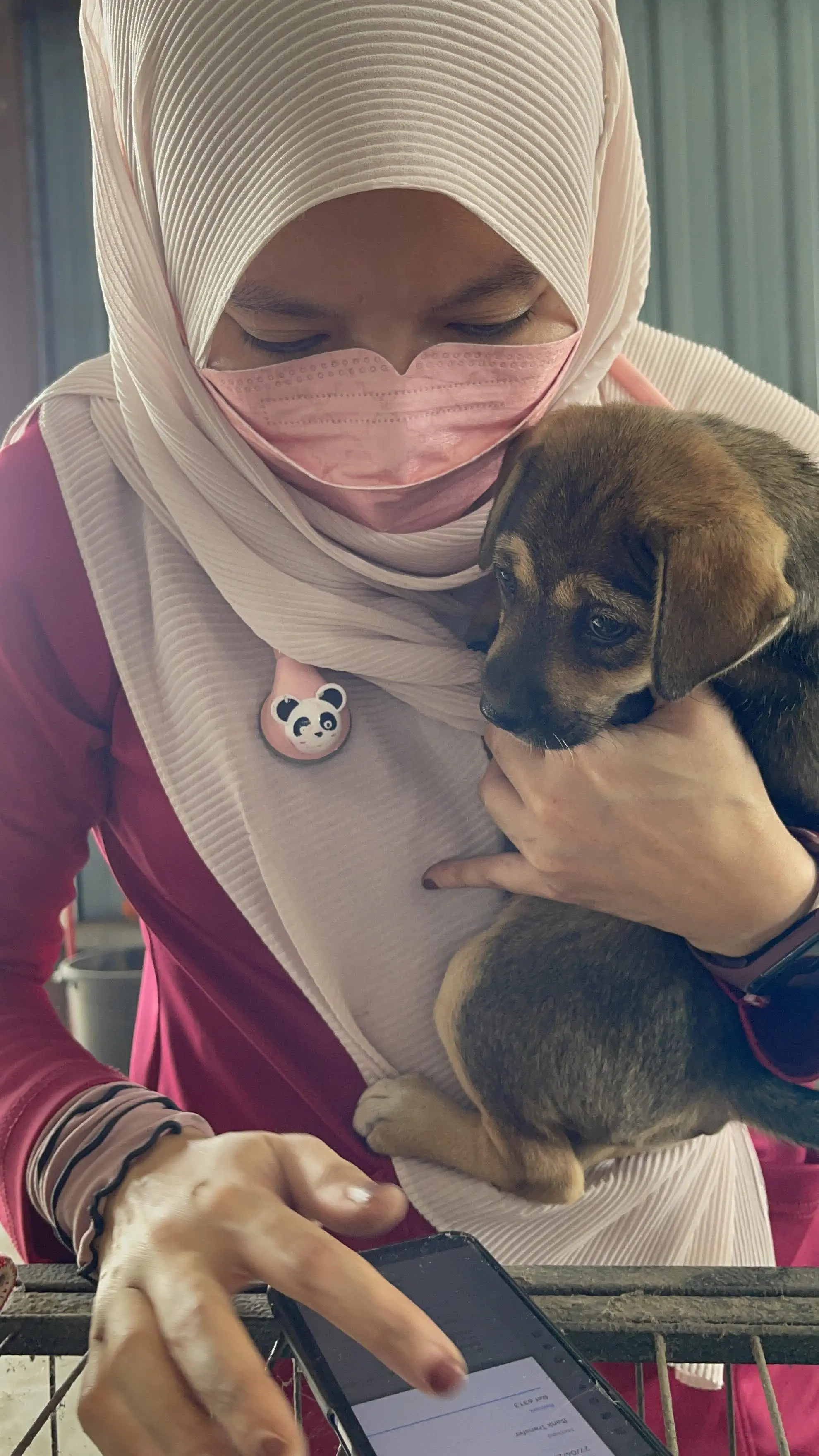 Dr Salehatul Khuzaimah holding a dog
