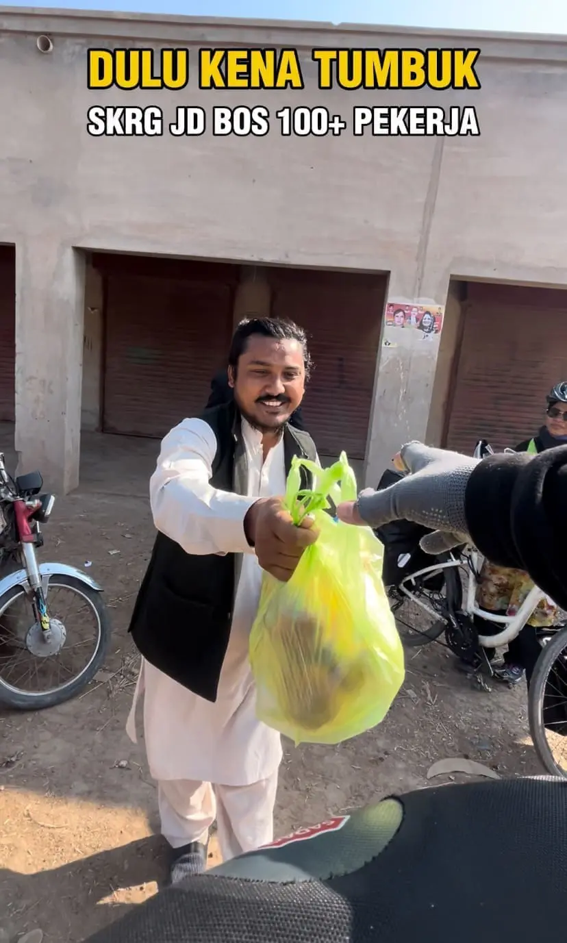Pakistani man handing in foods 