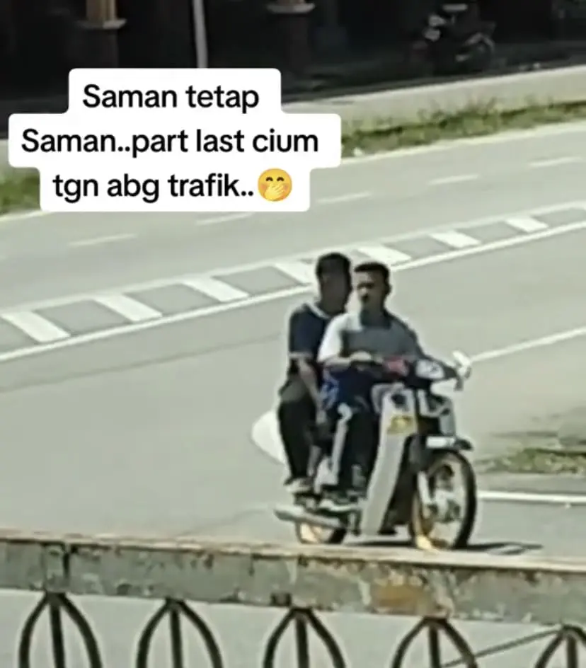 2 Malaysian teens riding a motorcycle without helmets 