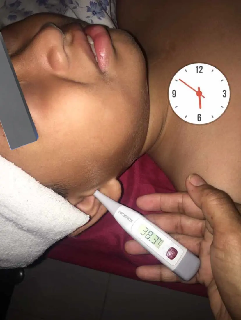 7 years old boy who got slapped by teacher having a fever