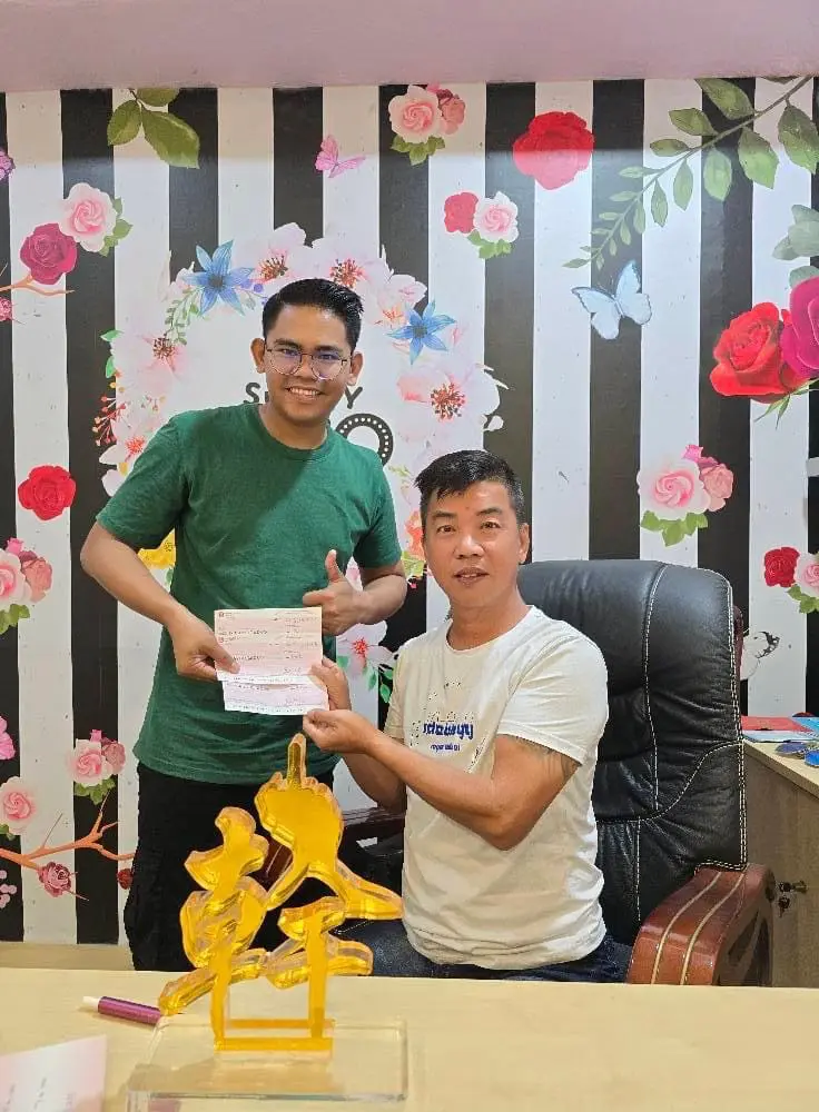 Sunny Seow with his Malay employee