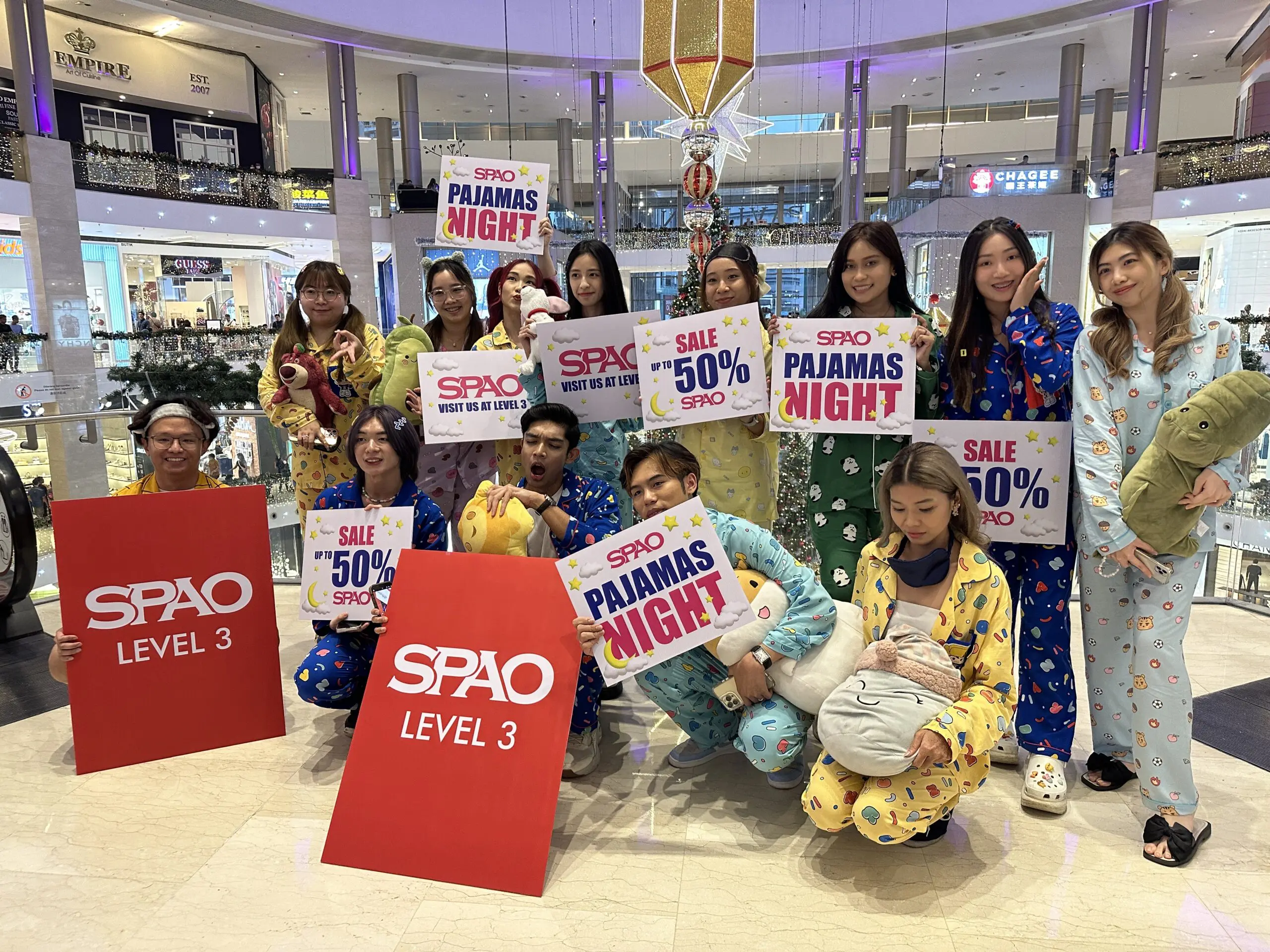 Msian Influencer standing inside Pavilion KL wearing variety of SPAO's Unisex pyjamas.