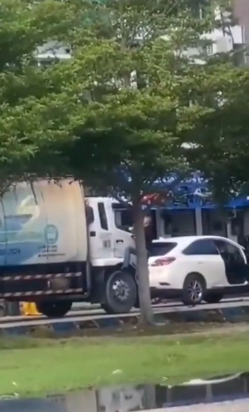 man arguing with garbage truck driver