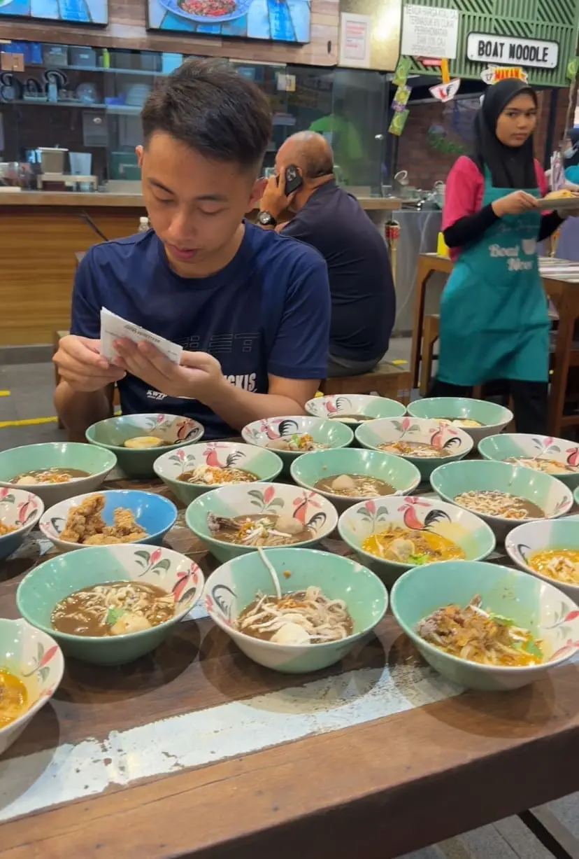 Tommy and friends at Boat Noodle with 28 bowls