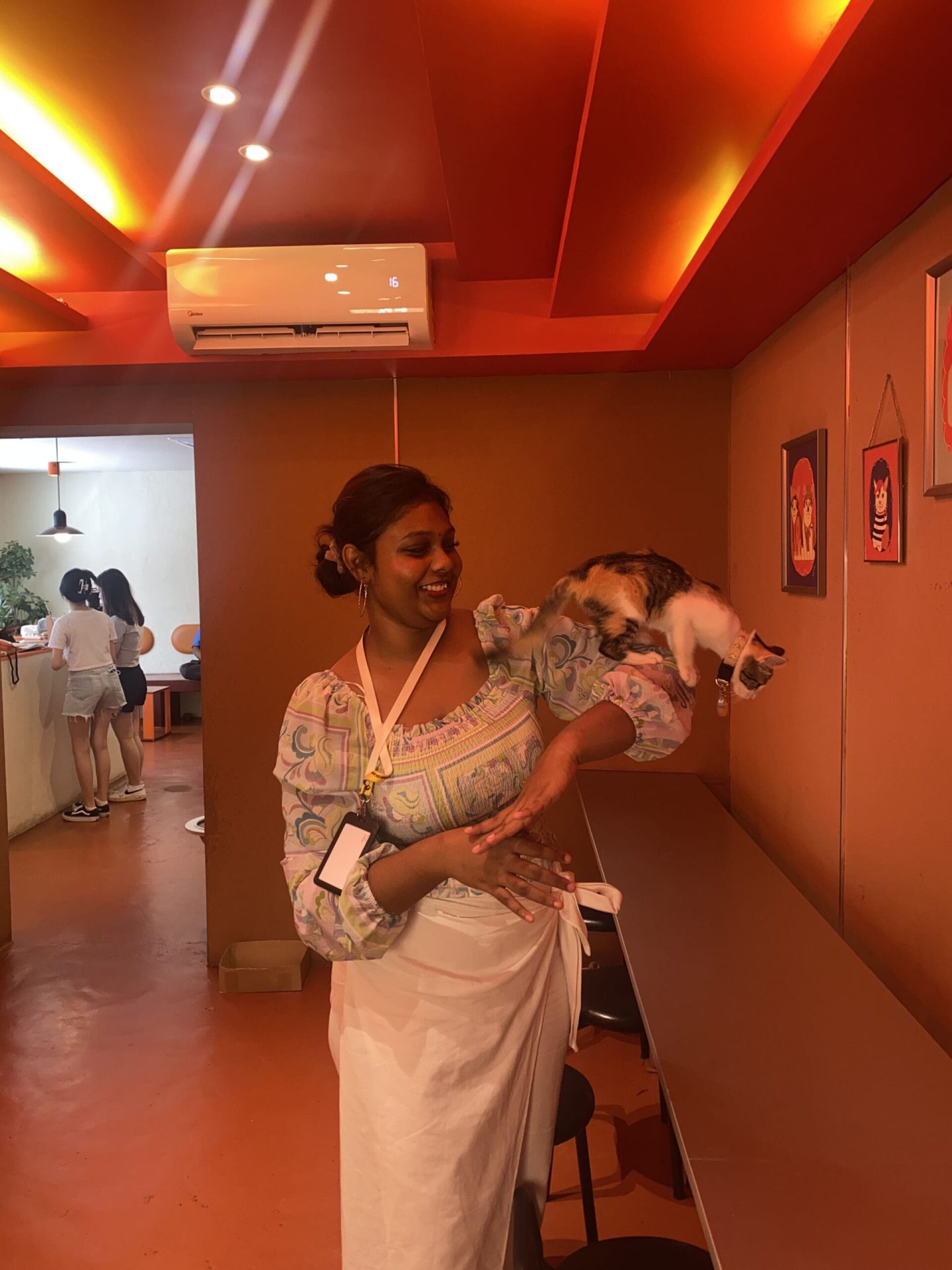 Playing with one of the cats at Poppy Kat Cafe