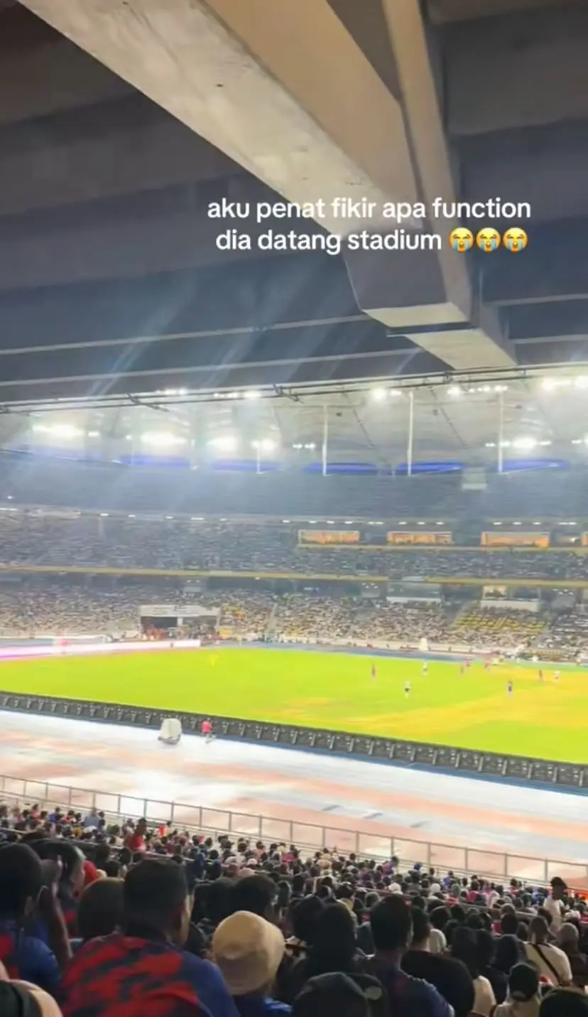 A football stadium filled with spectators