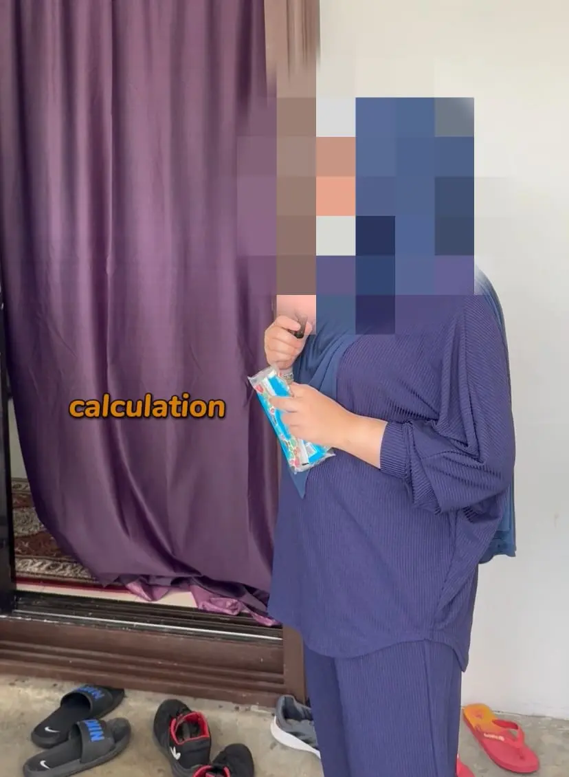 M'sian woman pixelated