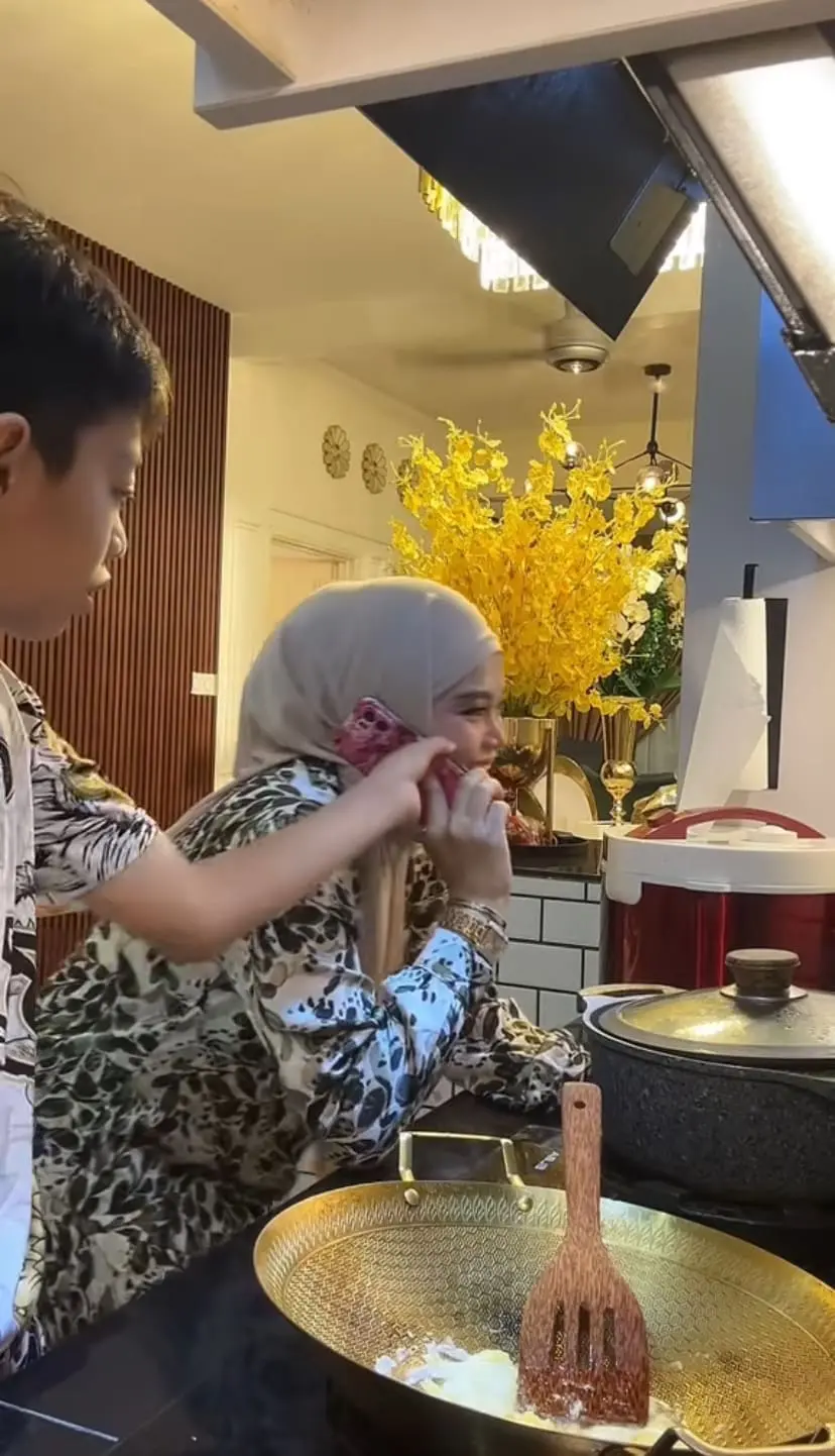 Son taking phone off from his mum