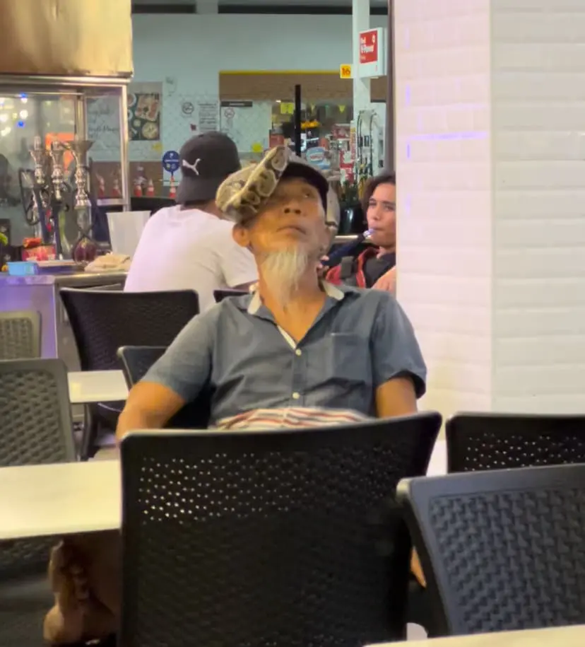 relaxed uncle has snake in his head - July 2024