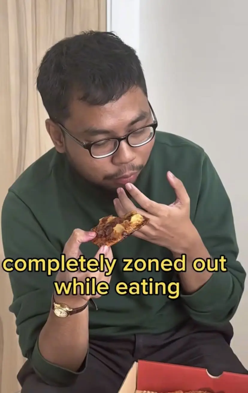 Team WeirdKaya munching the Cola Pizza