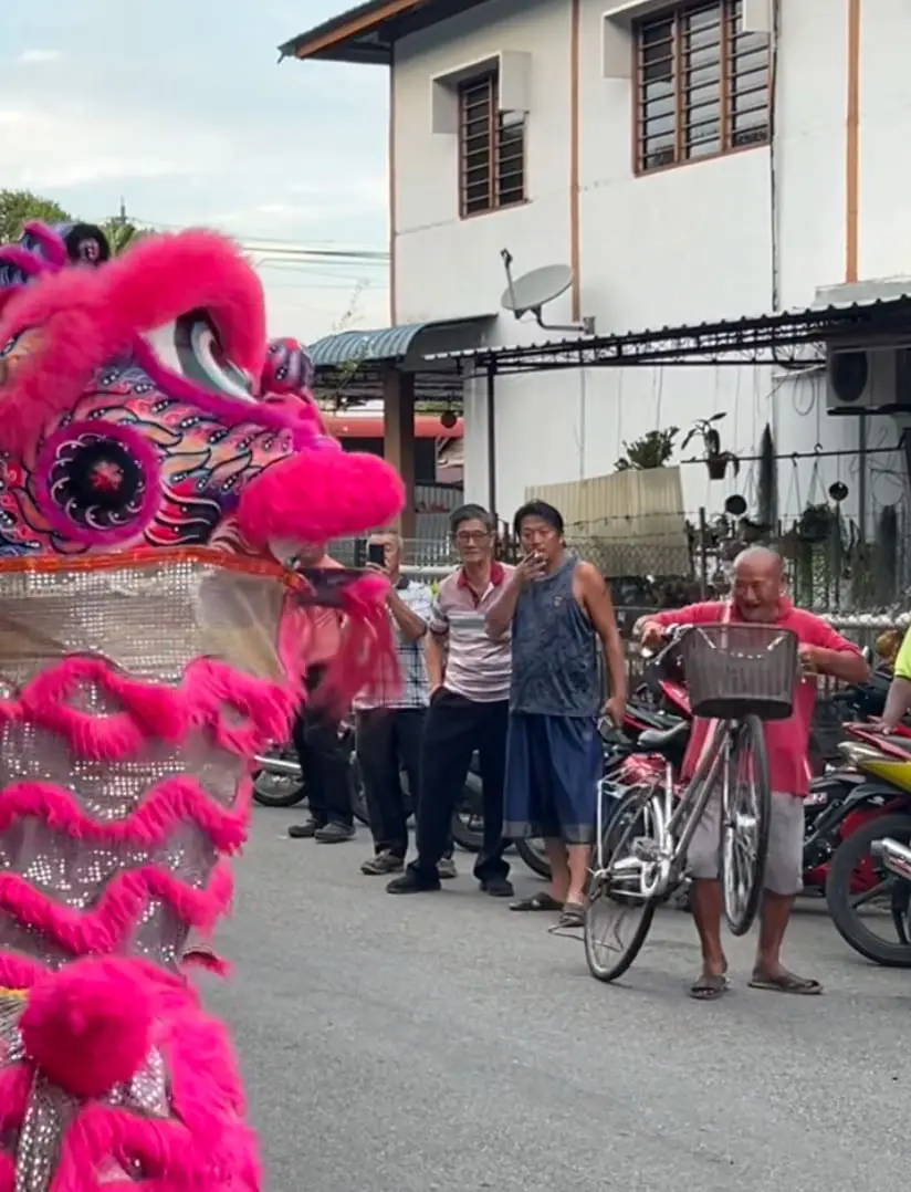 Uncle at Gurun Jaya Kedah vibing to lion dance performance