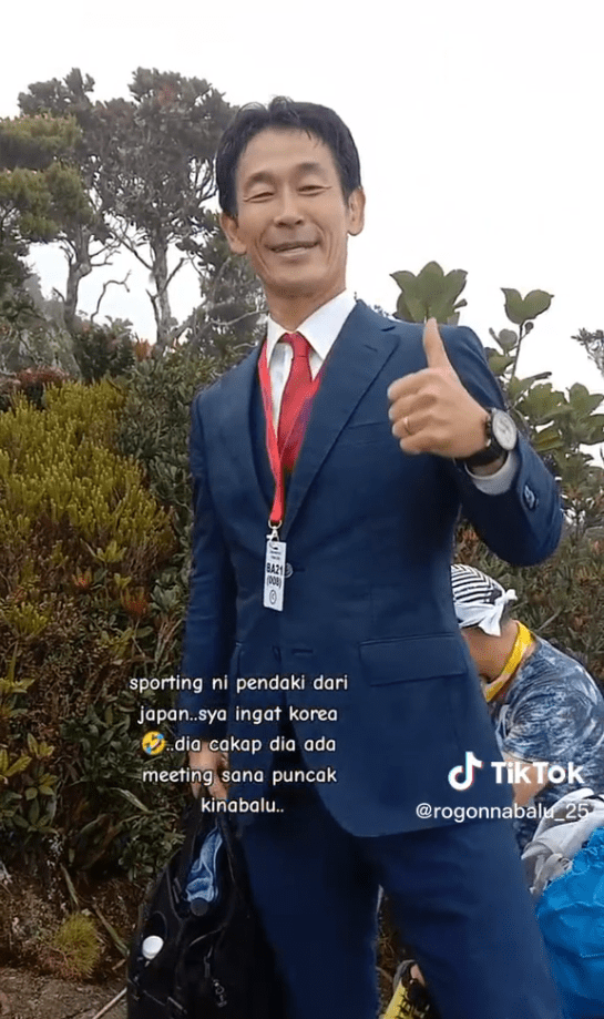 Japanese Man Climbs Mt Kinabalu In A Suit To Attend 'Business Meeting'
