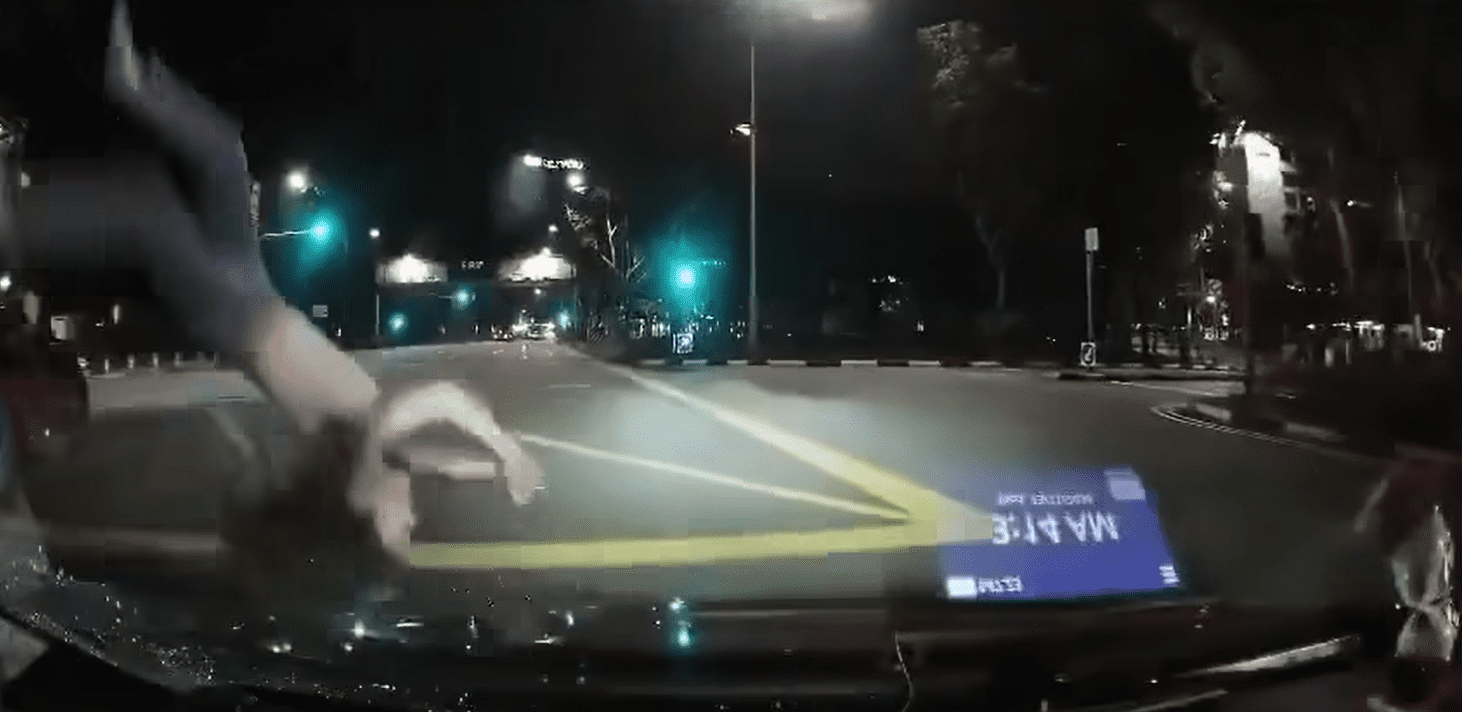 Jaywalking woman sent flying by car