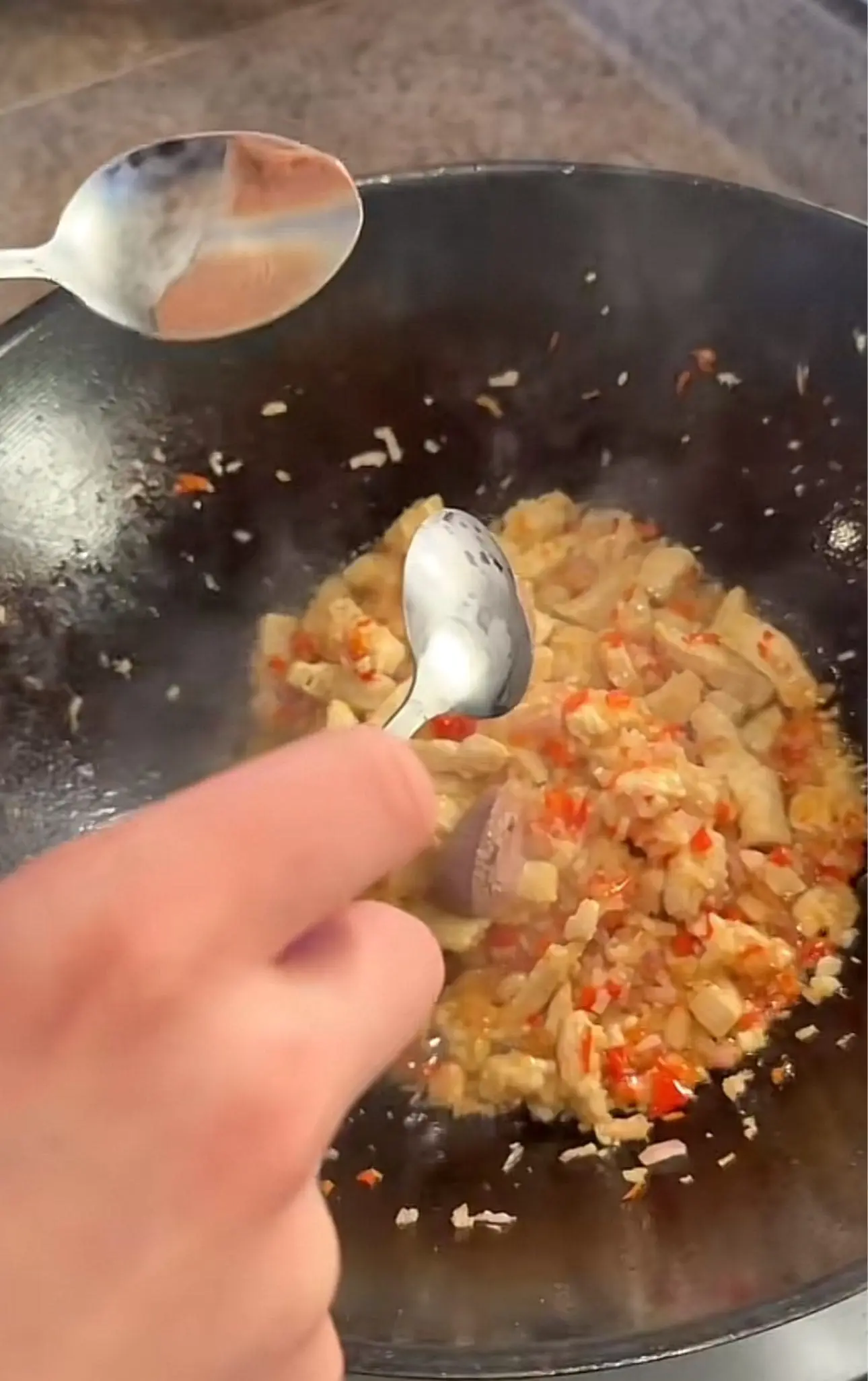 Kian adding belacan in the Nasi Goreng