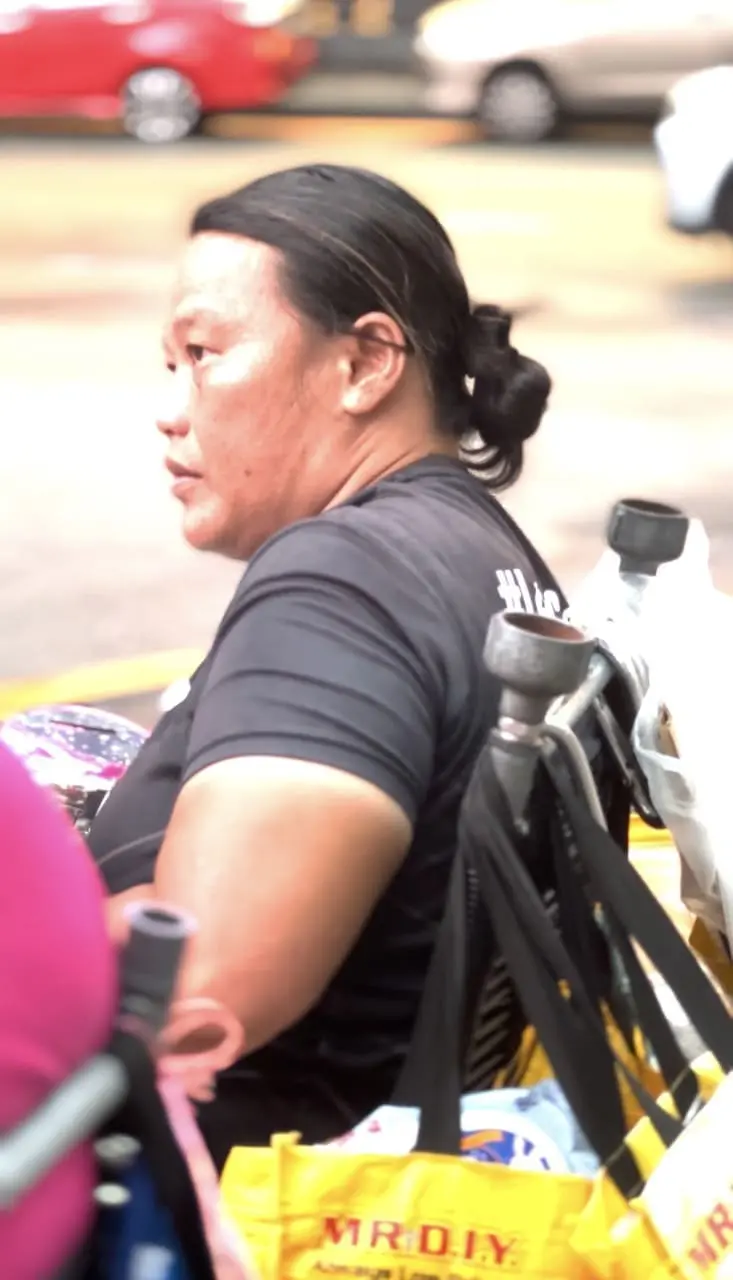 Koh Lee Peng sitting in her wheelchair