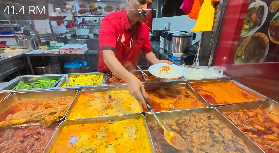 korean man eats nasi mamak