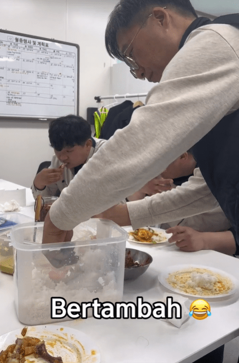 Korean man going for second helping of rice