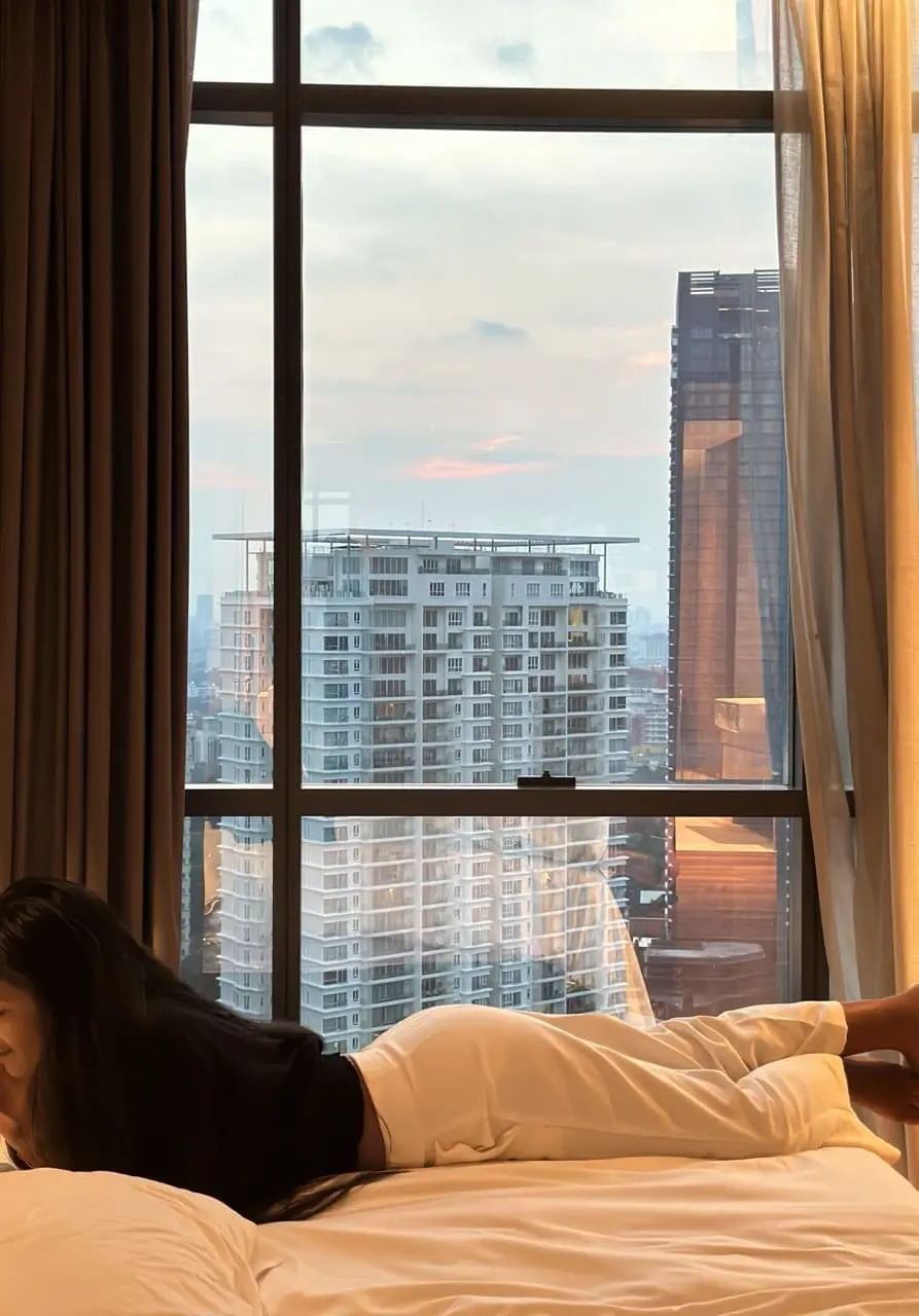 hotel view with a woman sleeping on the bed