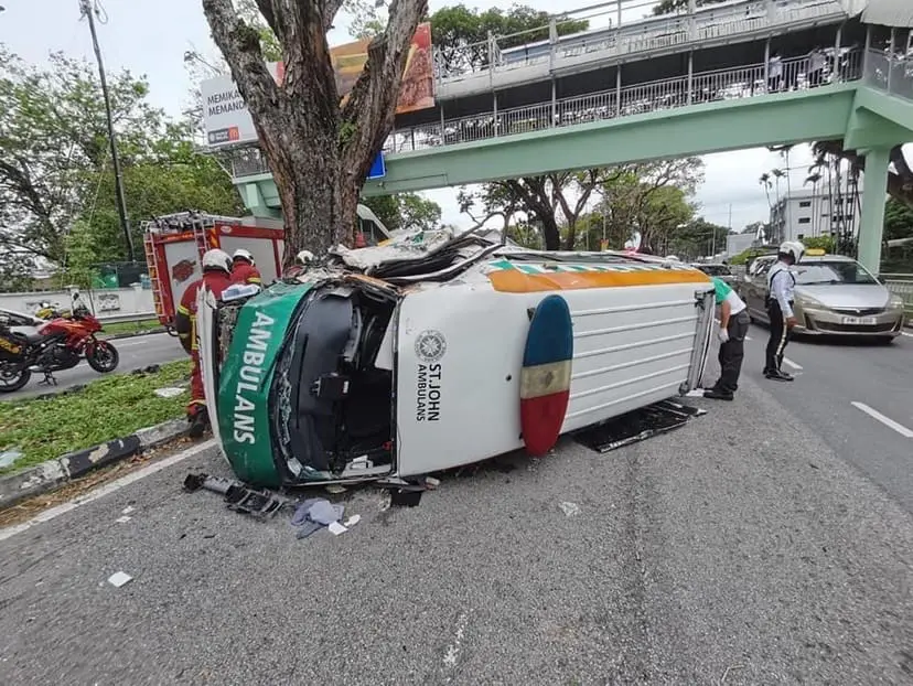 St John Ambulance Carrying Patient Inside Flips Over After Slamming Into A Divider