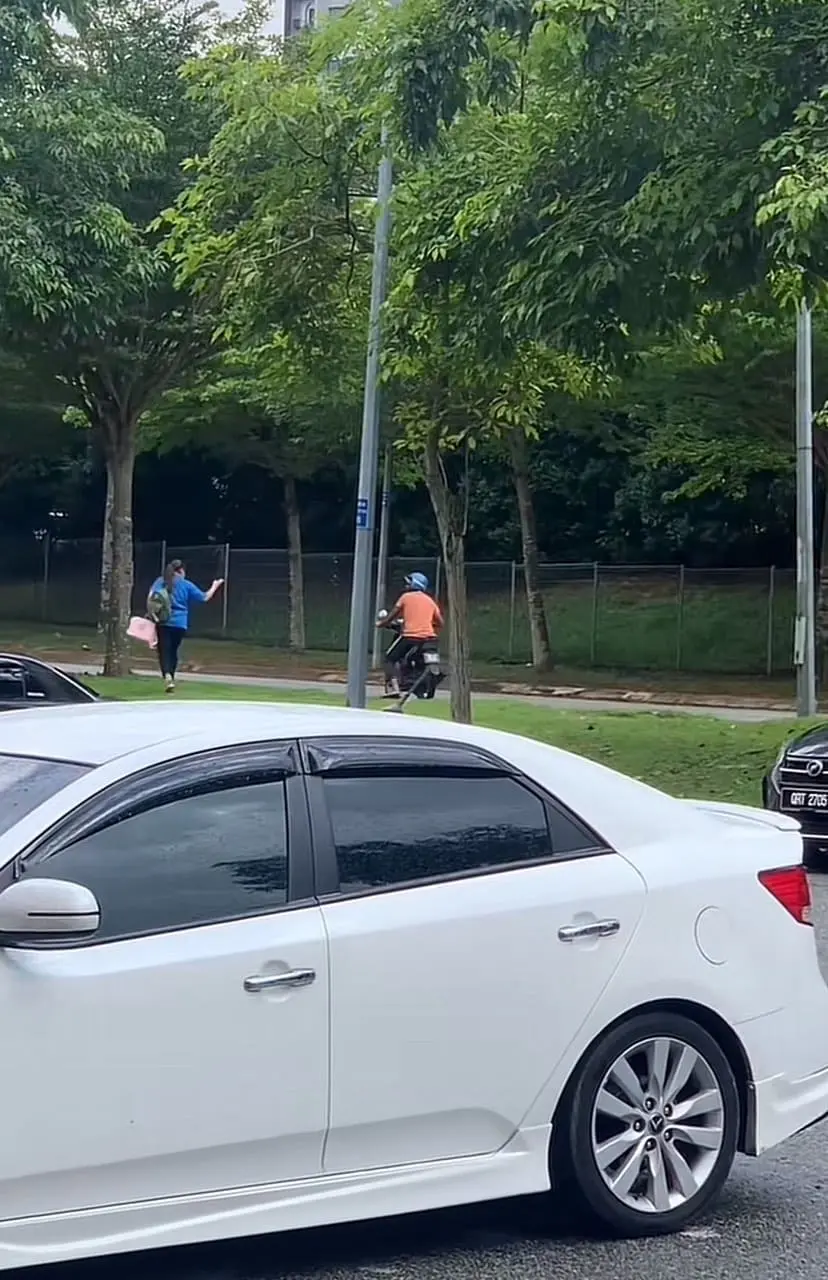 Woman storms away while man extending his hand towards her