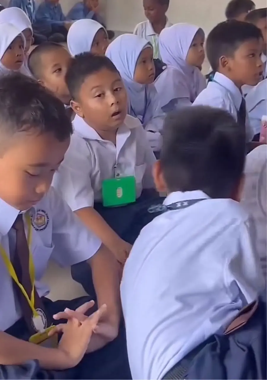 Boy's friend attempts to wake him up but still can't