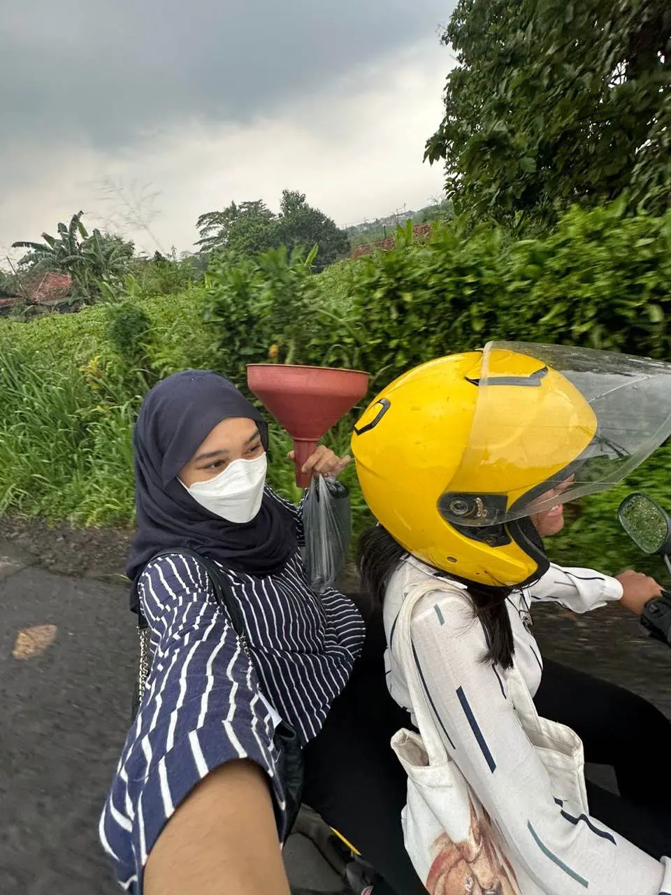 Sonea riding her bike with her friend