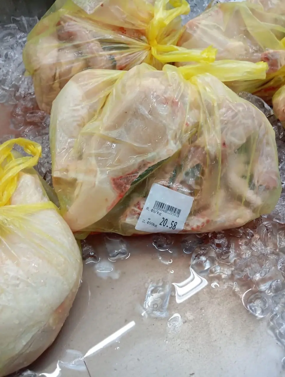 Raw chicken with price label on it