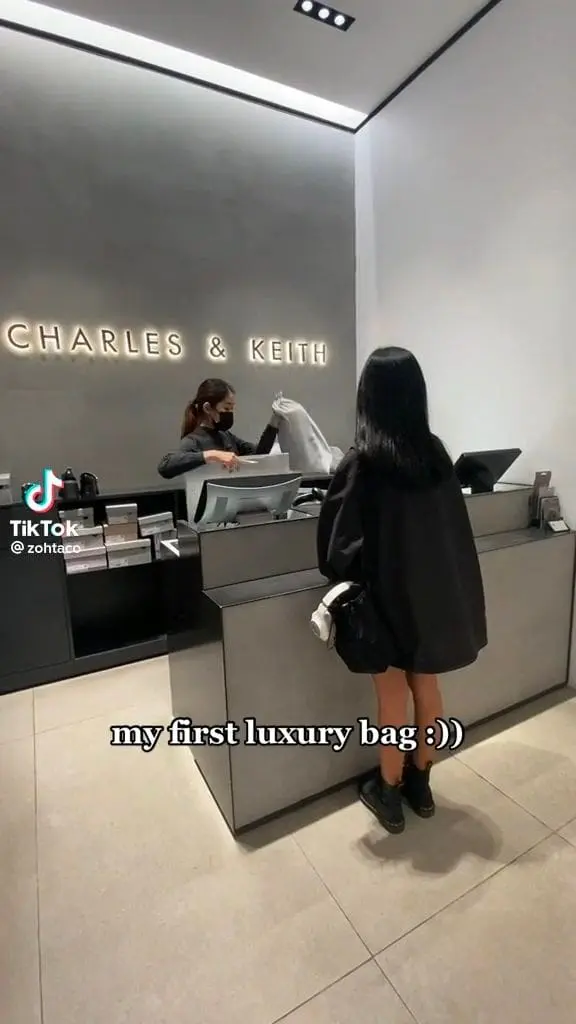 Zoe collecting Charles & Keith bag