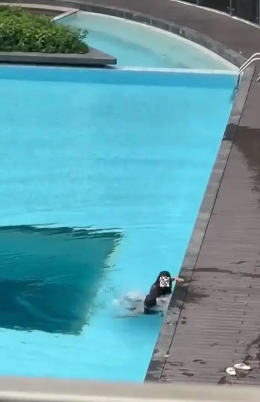 GF in the water arguing with her BF