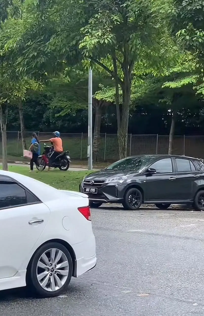 Woman storms away while man extending his hand towards her