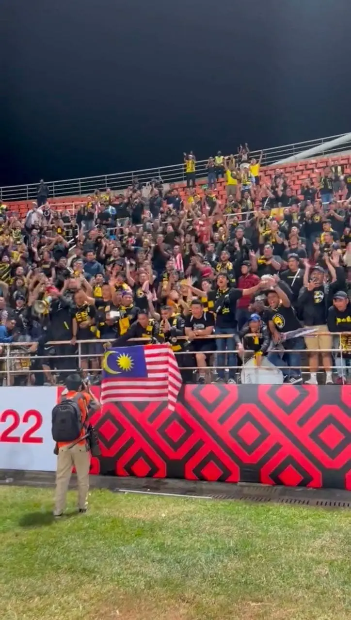 Malaysian football fans cheer for Thailand