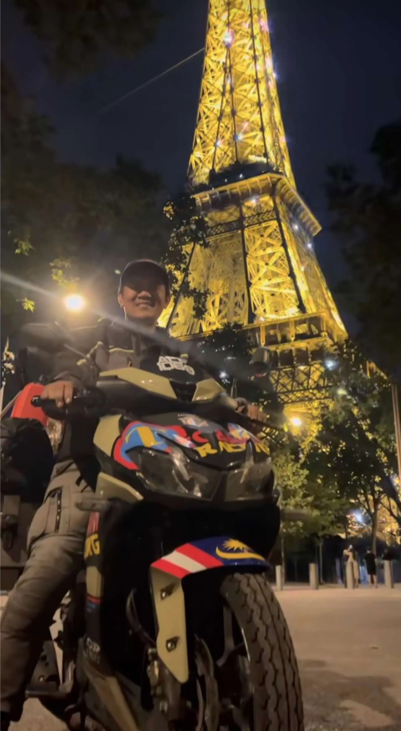Alif on his motor near Eifeel Tower