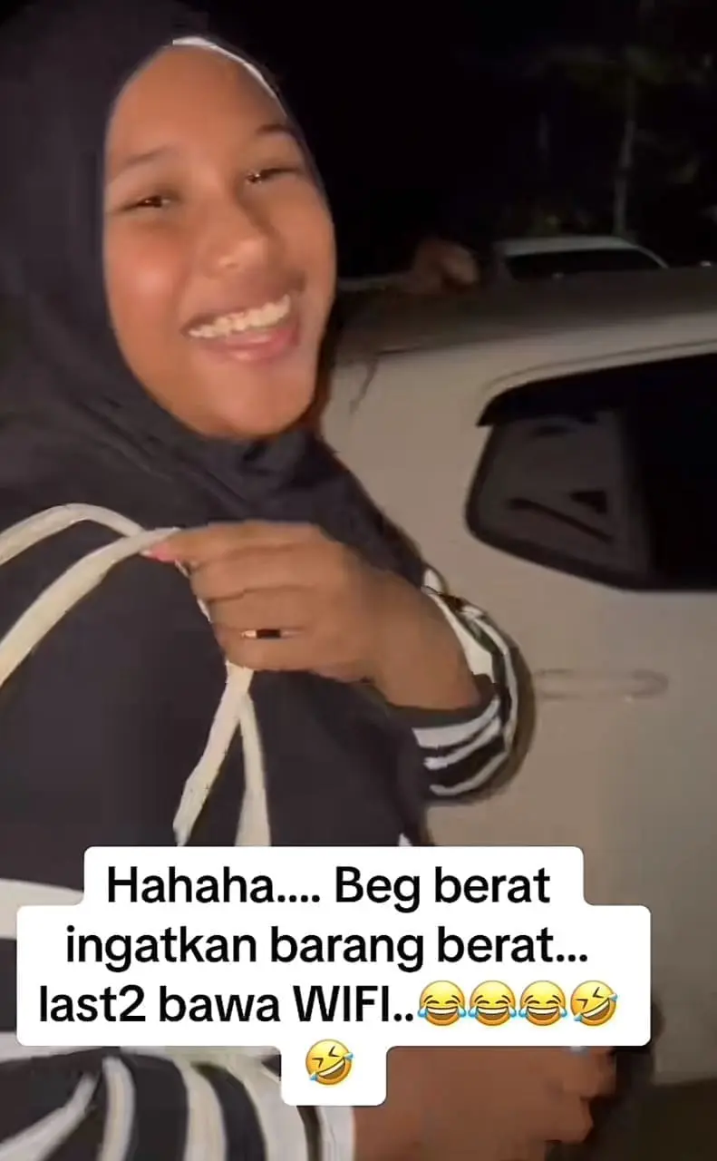 Woman smiling after finding a wifi router in her bag