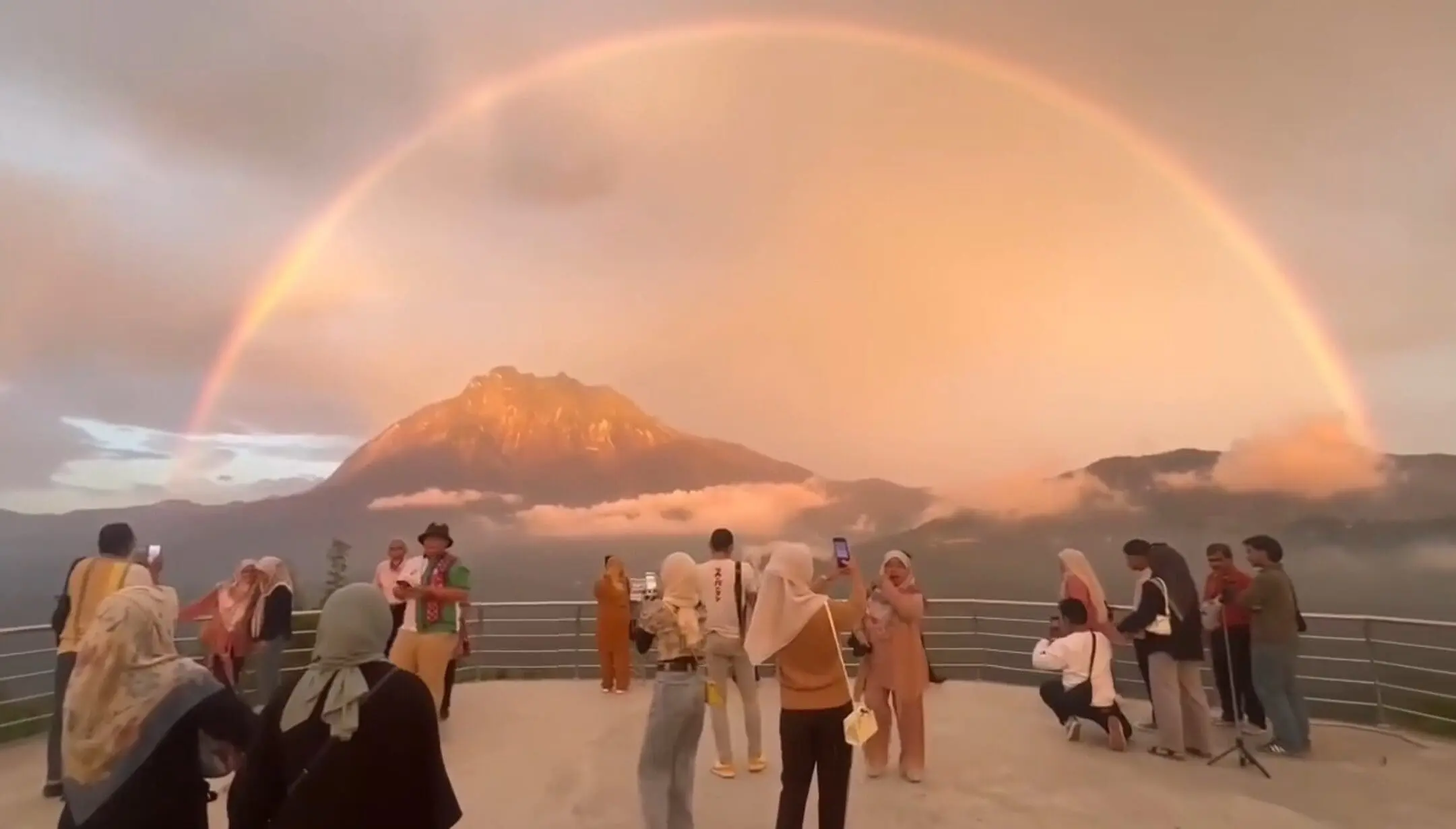 Poeple taking pictures and videos of the beautiful scenery