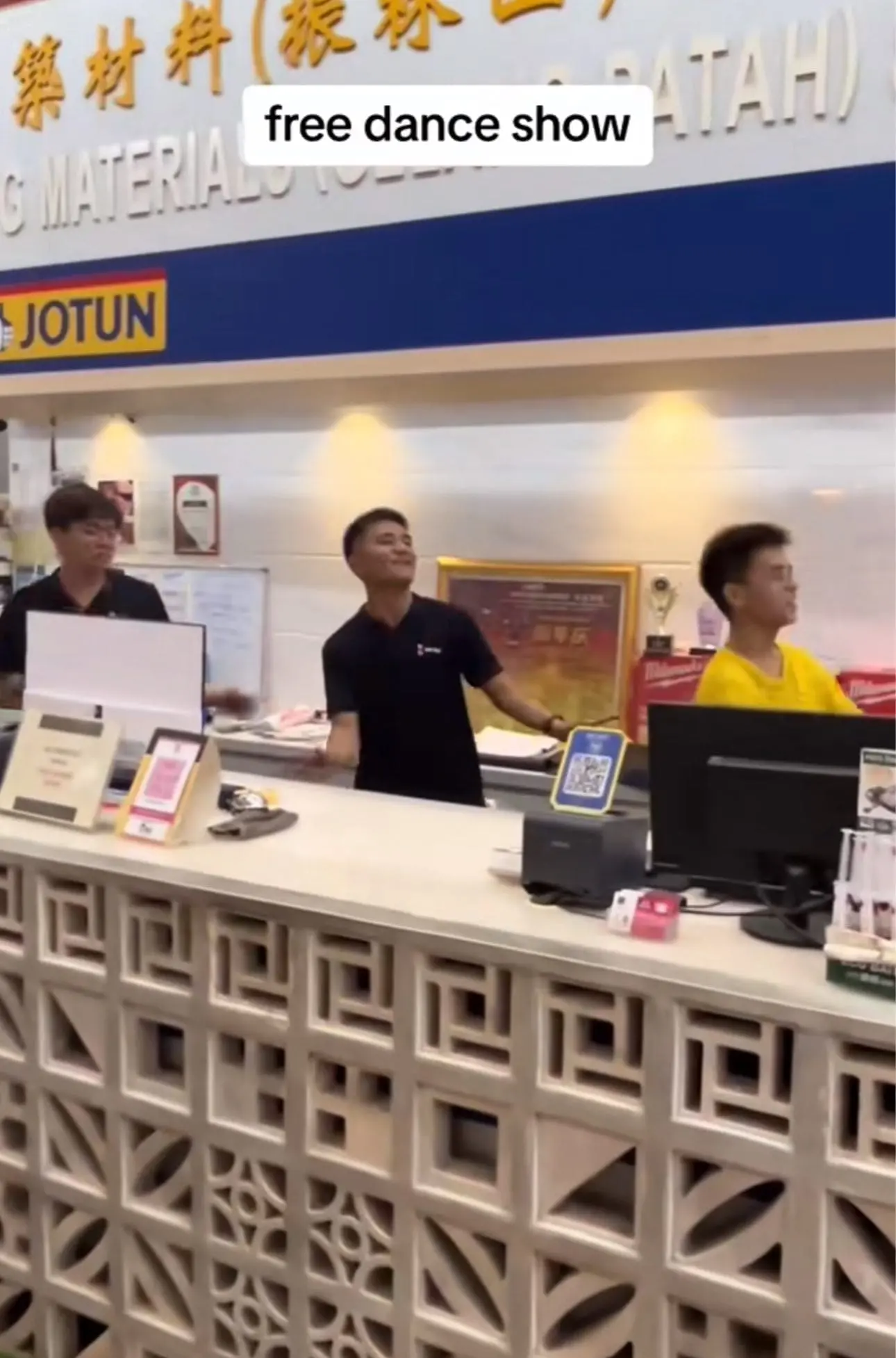 Employees dancing at a hardware store