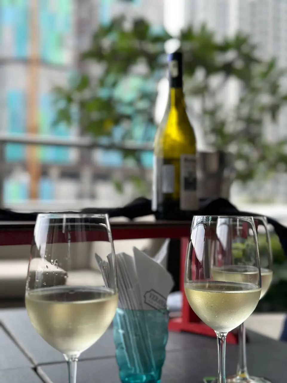 a bottle of wine and glasses filled with wine