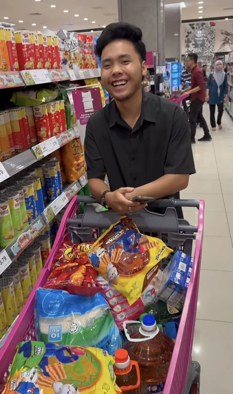 Khairul Aming's staff smiling