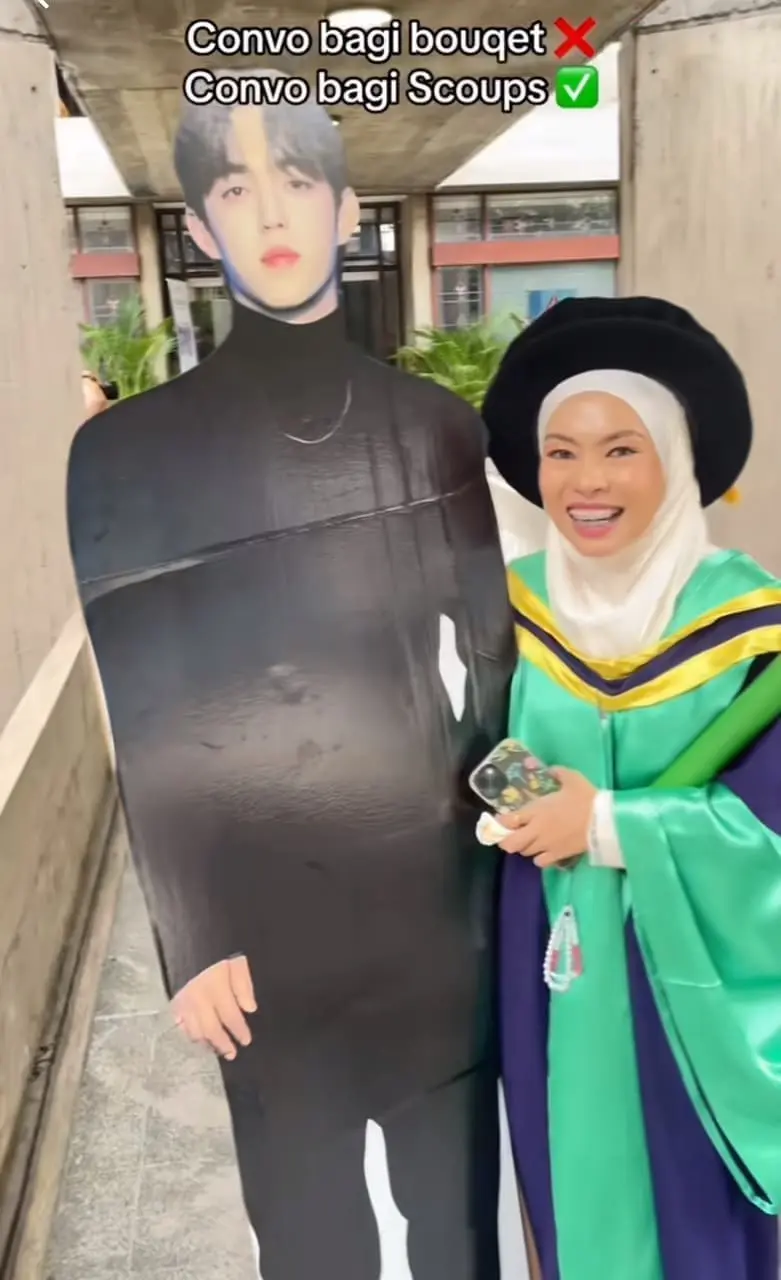 Msian woman's friend brings scoups cut out to her PHD graduation 