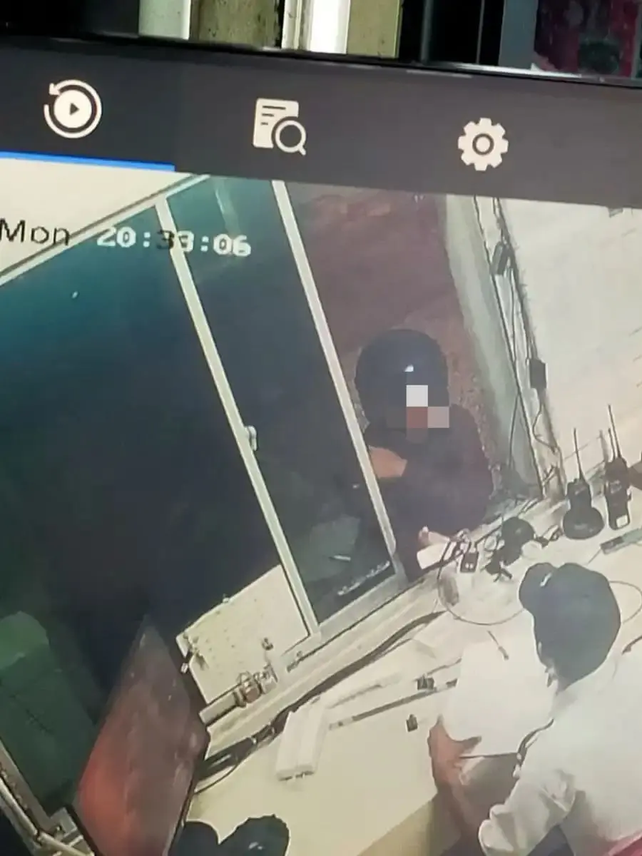 Foreigner liasing with security guard to enter his girlfriend's apartment