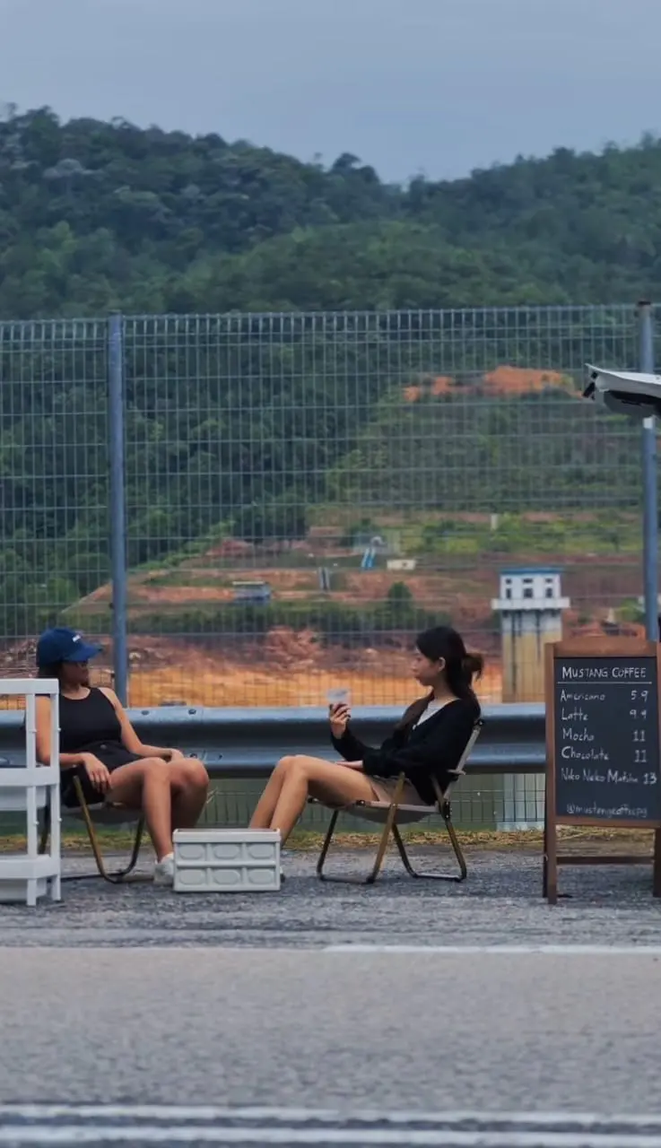 Rochelle and Leah sipping coffee at their coffee shop