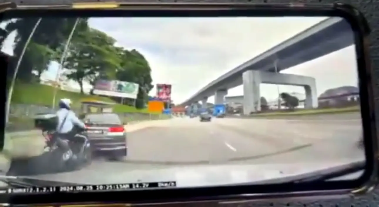 Car collides with PDRM officer's bike