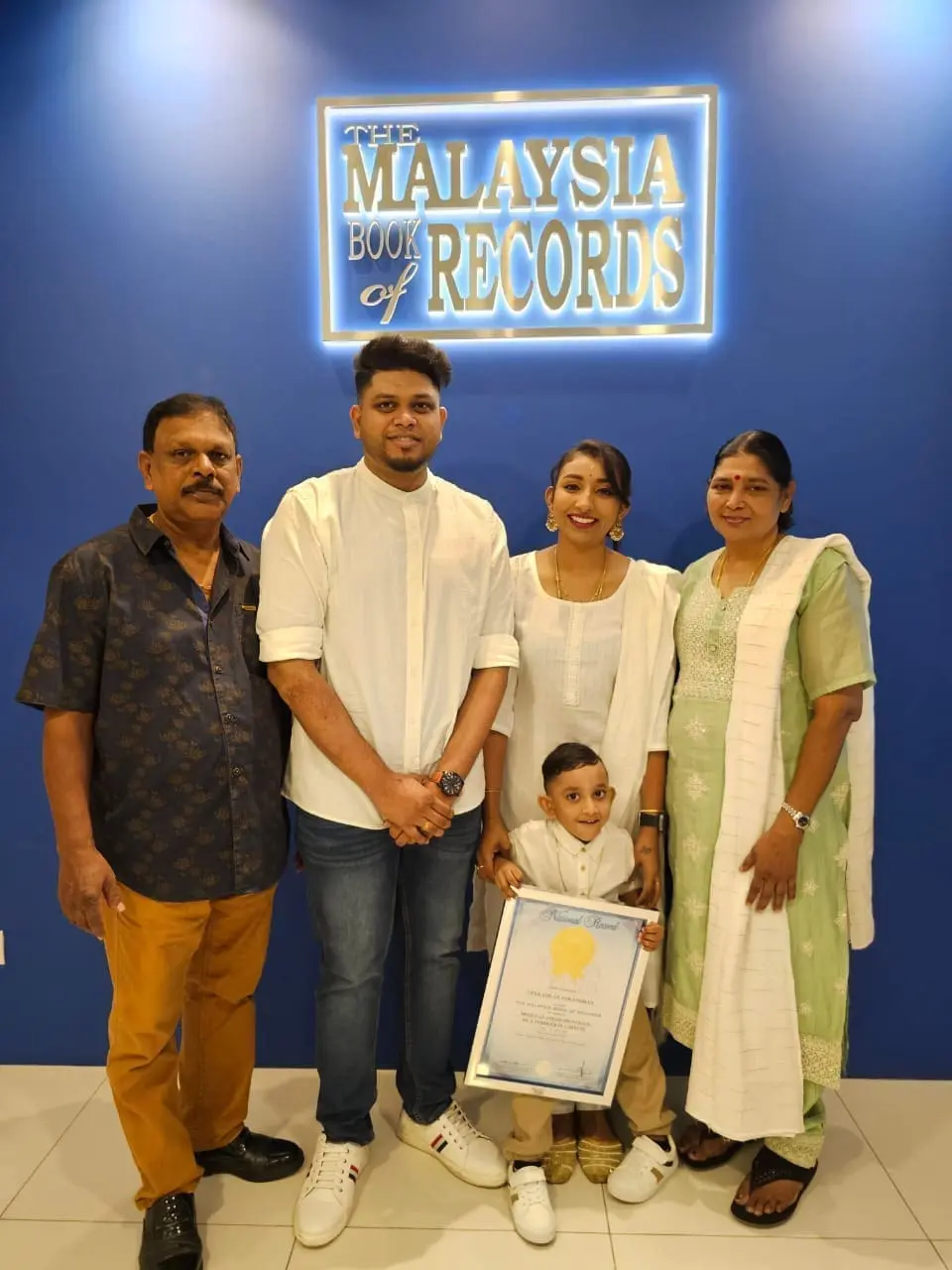 msian kid with his parents and grandparents