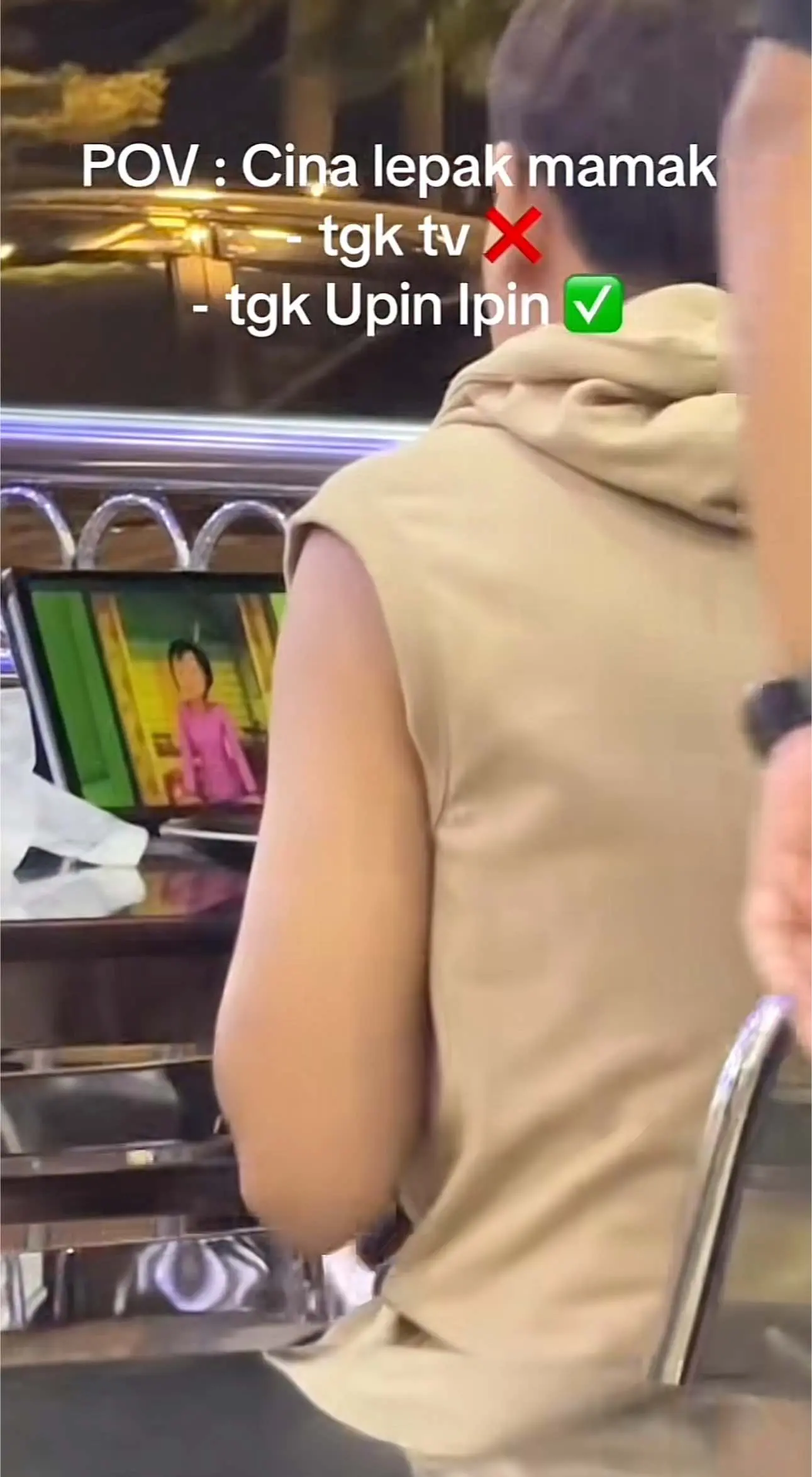 Both of them watching Upin Ipin at mamak