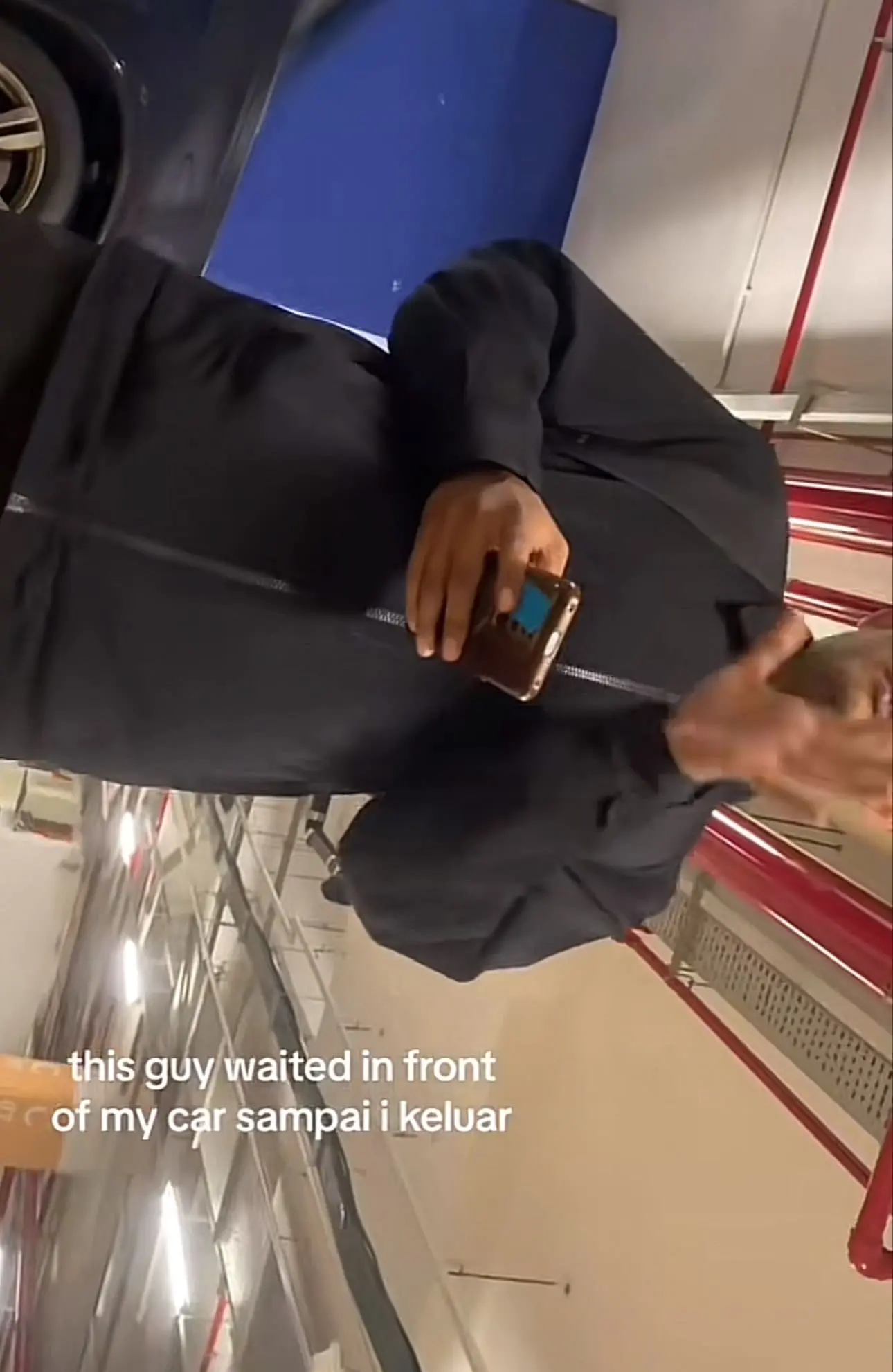 man taking picture of msian woman discreetly