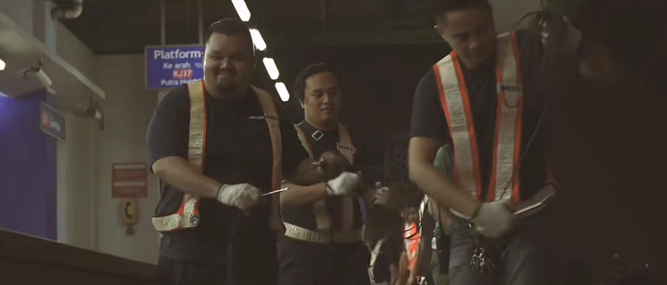 Contractors holding tools to fix the LRT trails