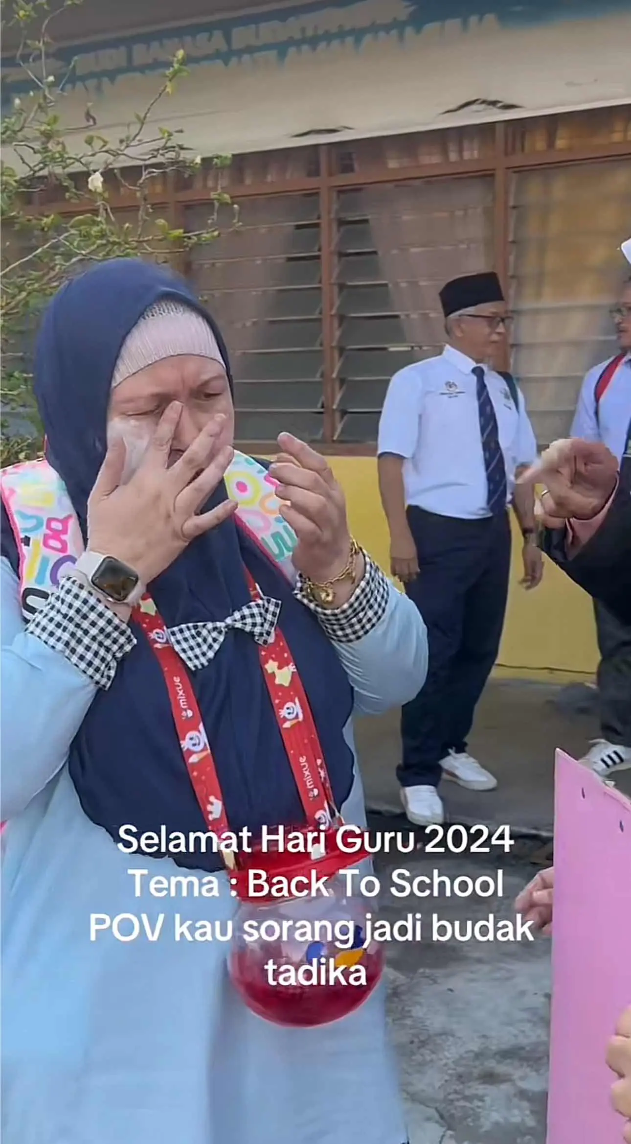 Teacher looks cute with baby powder smothered on her face